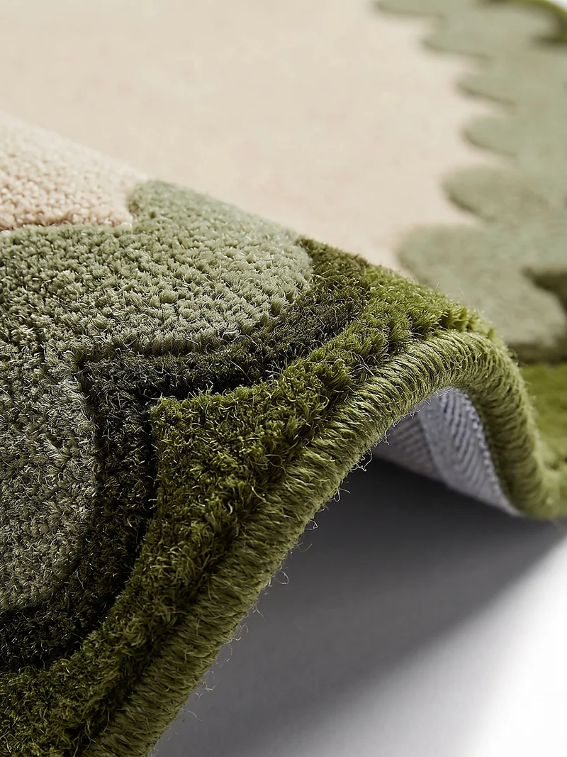 Wollteppich mit Wellenrand · handgetuftet, 5 mm Flor · 3.250 g/m²