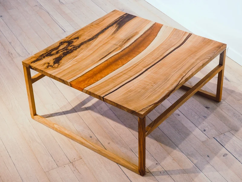 Katrin - Epoxidharz Couchtisch aus Kirsche mit Kupfer Harz