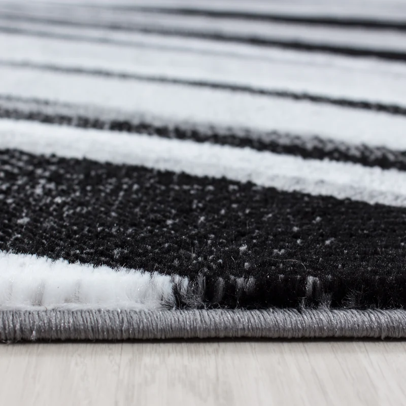 Kurzflor-Teppich Schwunglinien – Waschbar | Dynamisches Wellendesign | Heatset-Veredelung für Wolloptik