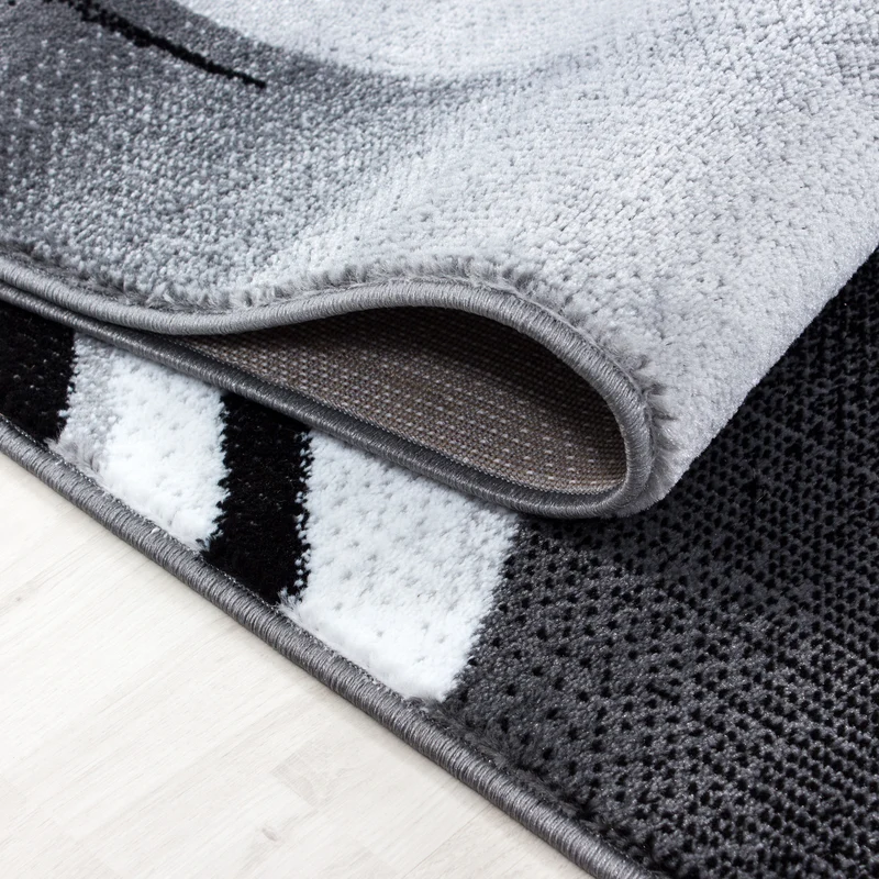 Kurzflor-Teppich Schwunglinien – Waschbar | Dynamisches Wellendesign | Heatset-Veredelung für Wolloptik