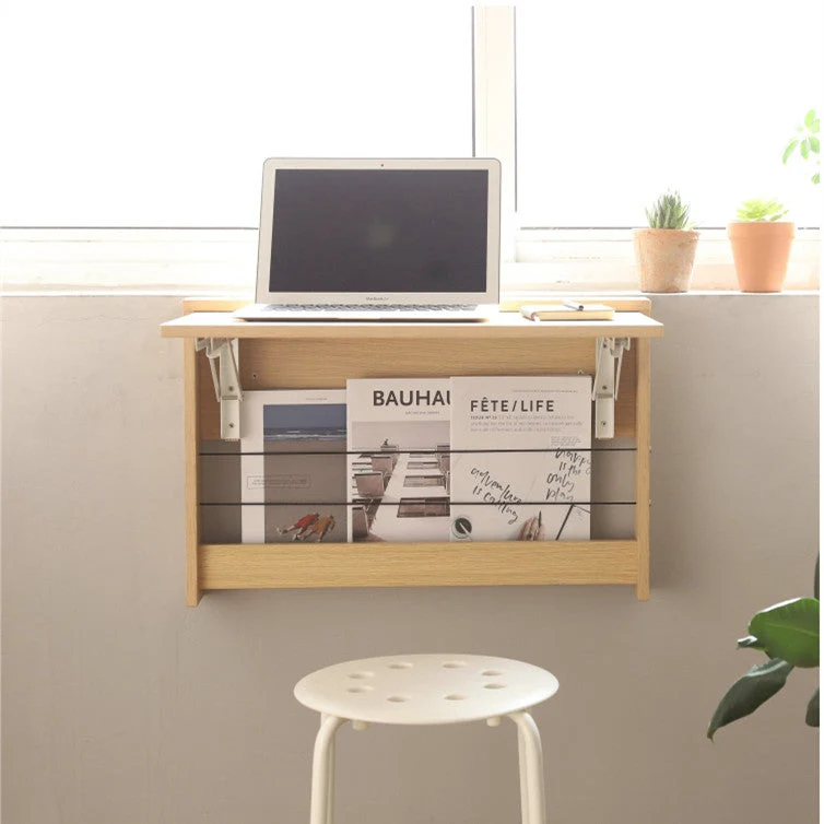 An der Wand befestigter faltbarer Schreibtisch mit Lagerregal