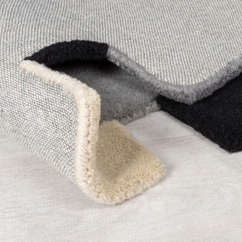 Wollteppich Cut-Out-Geometrie · 100 % Wolle · 10 mm Kurzflor