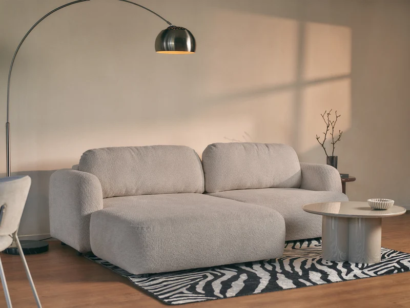 Ecksofa mit Schlafunktion Tvoya, L-förmig, linksseitig, grau-beiges Bouclé