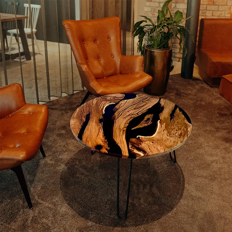 Couchtisch Nussbaum rund mit Epoxidharz schwarz | Modell Wildsee
