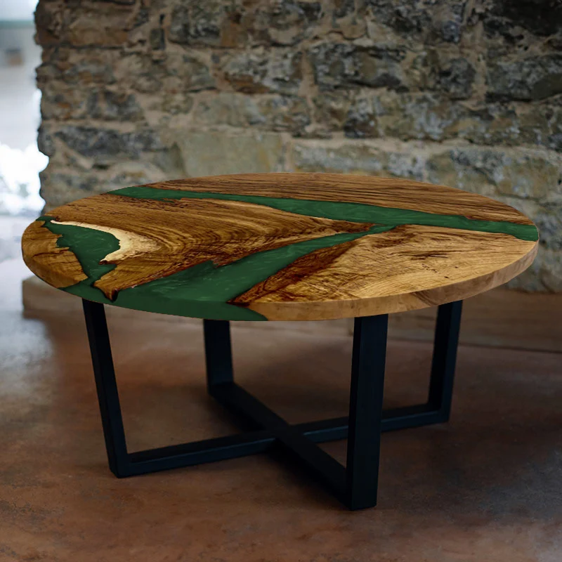 Couchtisch rund aus Nussbaum mit Epoxidharz smaragd-grün | Modell Hegauvulkan