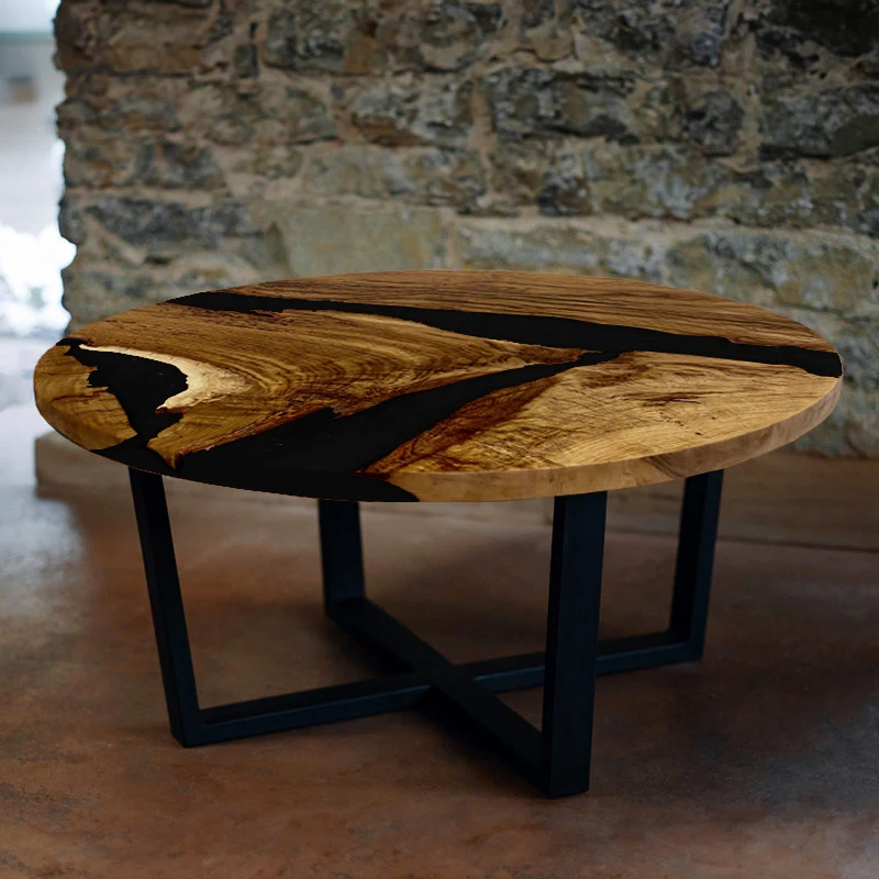 Couchtisch rund aus Nussbaum mit Epoxidharz schwarz | Modell Hegauvulkan