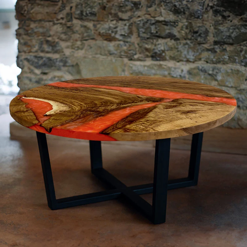 Couchtisch rund aus Nussbaum mit Epoxidharz lava | Modell Hegauvulkan