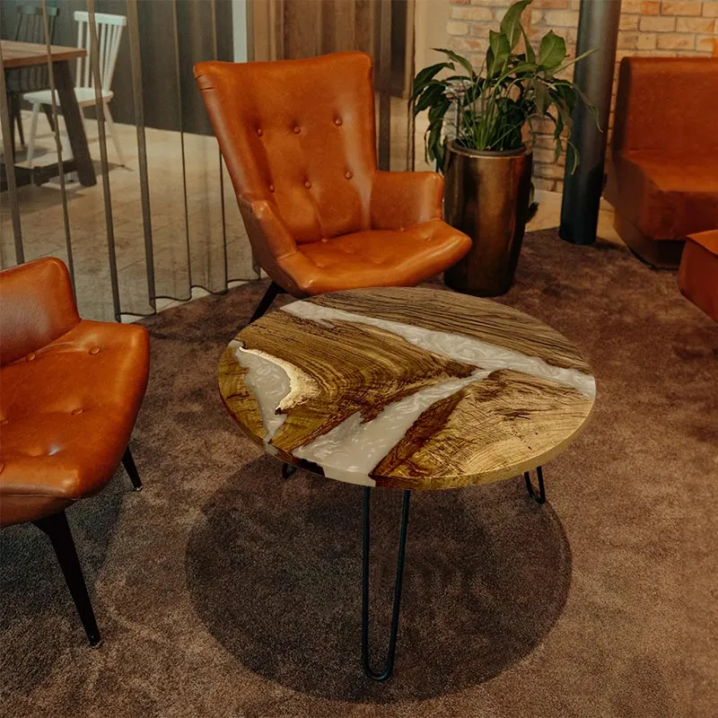 Couchtisch rund aus Nussbaum mit Epoxidharz elfenbein | Modell Hegauvulkan