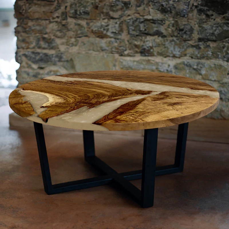 Couchtisch rund aus Nussbaum mit Epoxidharz elfenbein | Modell Hegauvulkan