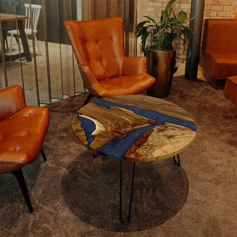 Couchtisch rund aus Nussbaum mit Epoxidharz blau | Modell Hegauvulkan