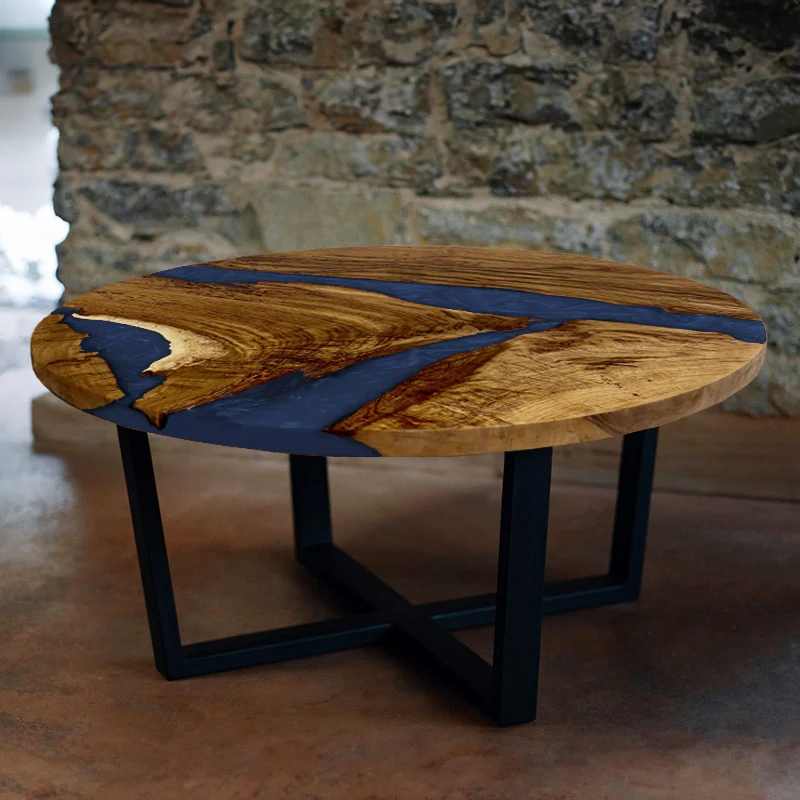 Couchtisch rund aus Nussbaum mit Epoxidharz blau | Modell Hegauvulkan