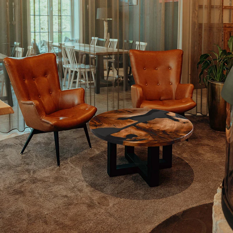 Couchtisch rund aus Nussbaum I Epoxidharz anthrazit | Modell Schluchsee