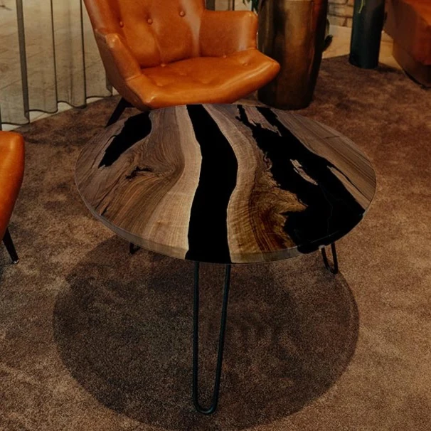 Couchtisch Nussbaum rund mit Epoxidharz schwarz | Modell Gletschersee