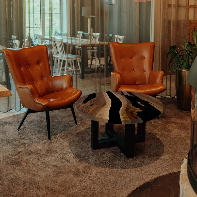Couchtisch Nussbaum rund mit Epoxidharz schwarz | Modell Gletschersee