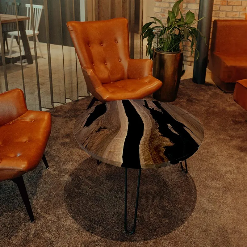 Couchtisch Nussbaum rund mit Epoxidharz schwarz | Modell Gletschersee